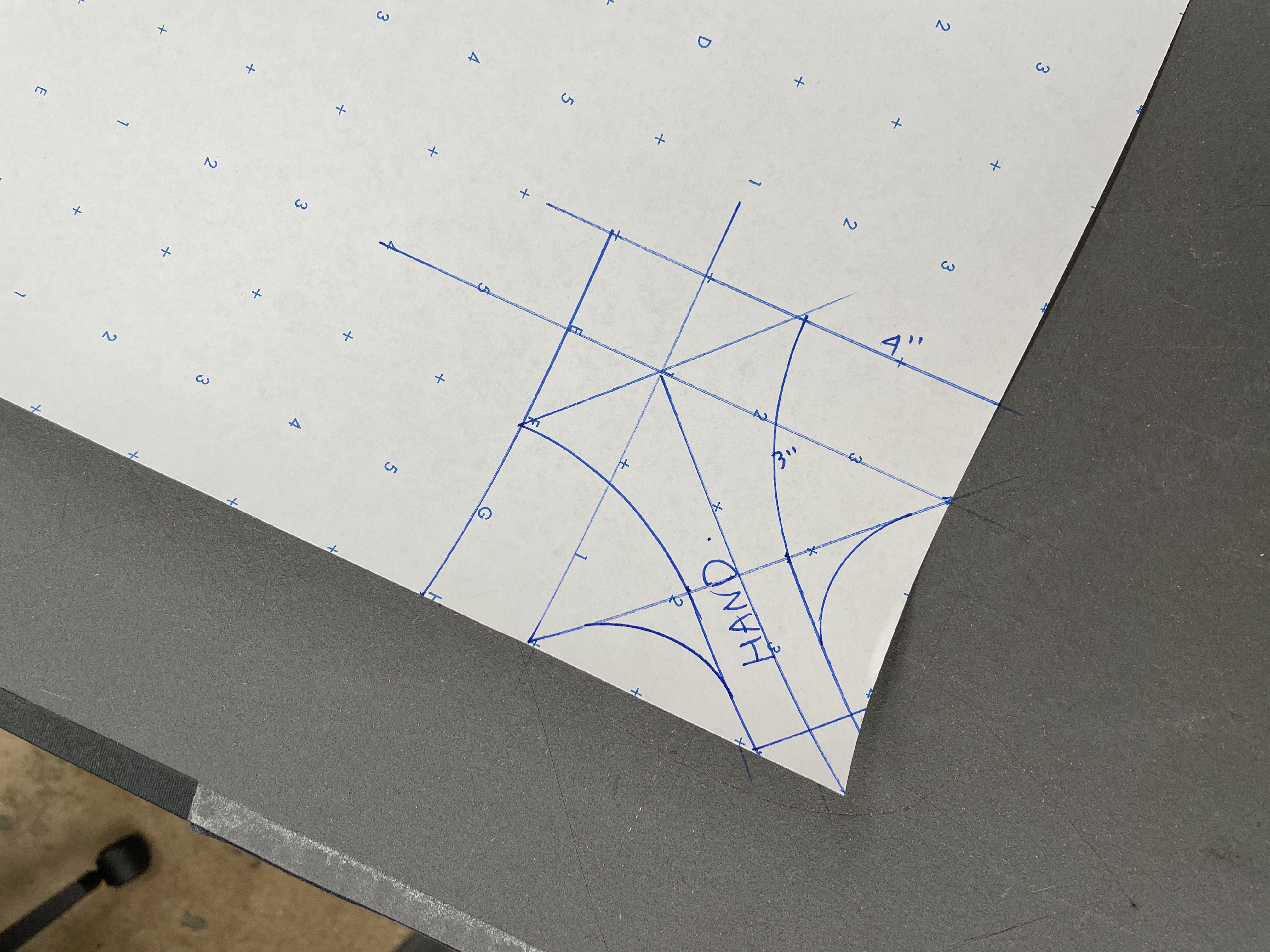 Hand-drawn pattern detail showing hand opening with blue pen measurements